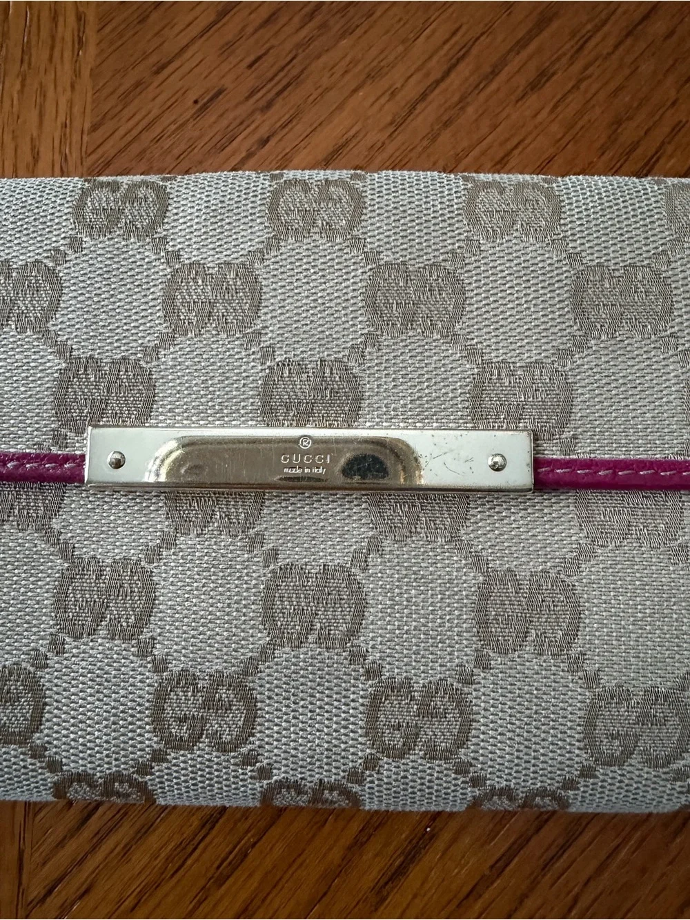 Authentic Gucci Beige Monogram Wallet with Pink Trim.